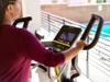 LifeSpan-Fitness-E5i-commercial-elliptical-machine-user-on-machine-handlebars