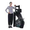 Water rower folded up next to a person